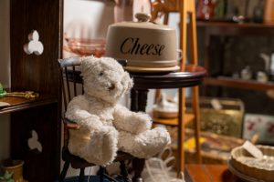 A vintage teddy bear on a chair at Yarnton Antiques Centre