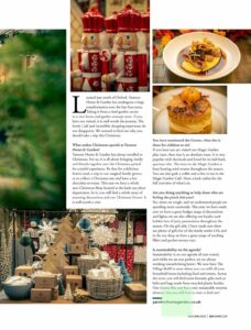 A magazine article showing images of table of christmas decorations and home cooked cafe food of sausages and mash and a cake plus a questions and answer session