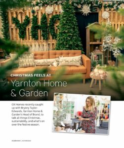 A magazine page featuring an orange sofa against a backdrop of Christmas trees and a written feature about Yarnton Home & Garden